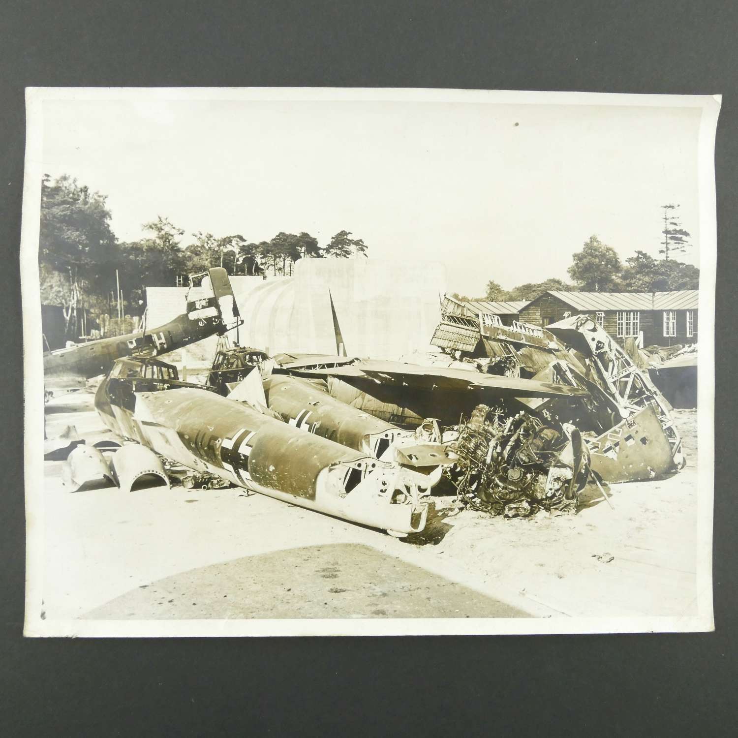 Press photograph - wrecked Luftwaffe aircraft on RAF station